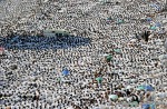 An ambulance is parked among thousands of Muslim pilgrims praying near the Namira Mosque at Mount Arafat, southeast of the Saudi holy city of Mecca, on November 15, 2010. Pilgrims flooded into the Arafat plain from Mecca and Mina before dawn for a key ritual around the site where prophet Mohammed gave his farewell sermon on this day in the Islamic calendar 1,378 years ago. Pilgrims spend the day at Arafat in reflection and reading the Koran. (MUSTAFA OZER/AFP/Getty Images) #