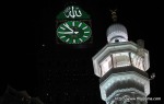 The massive new clock atop the newly-completed Abraj Al-Bait Towers, above tens of thousands of Muslim pilgrims walking around the Kaaba, inside the Grand Mosque in Mecca, Saudi Arabia on Wednesday, Nov. 10, 2010. (AP Photo/Hassan Ammar) #